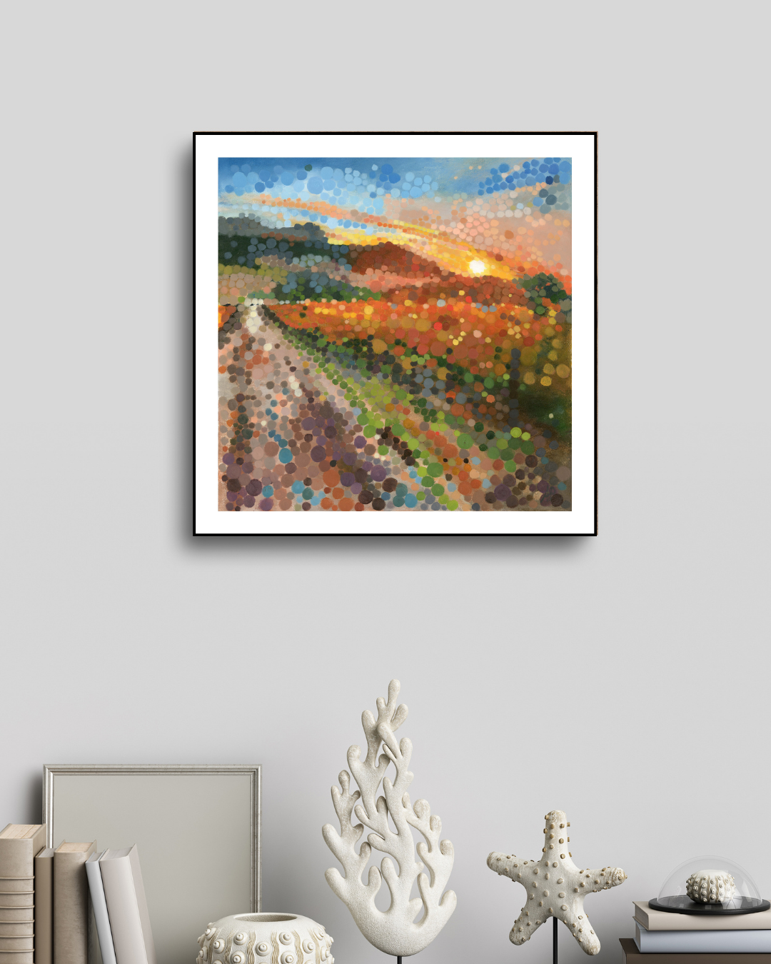 Limited edition print of ‘Cape Winelands at Sunset’ displayed in a cream-toned interior. The warm abstract landscape with circular dot patterns adds depth, rhythm, and golden light to the soft, neutral space.