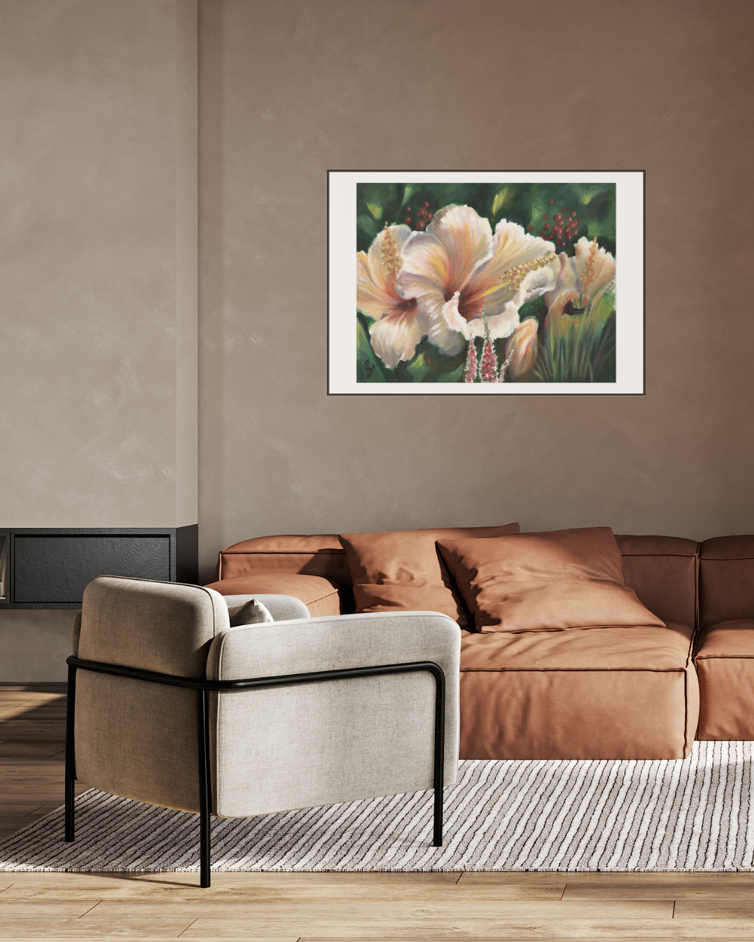 Limited edition print of ‘South Coast Hibiscus’ by Stephreen Mapstone displayed in a cream-toned room above a rust leather couch. The vibrant floral artwork adds a tropical touch and rich contrast to the warm, earthy decor.