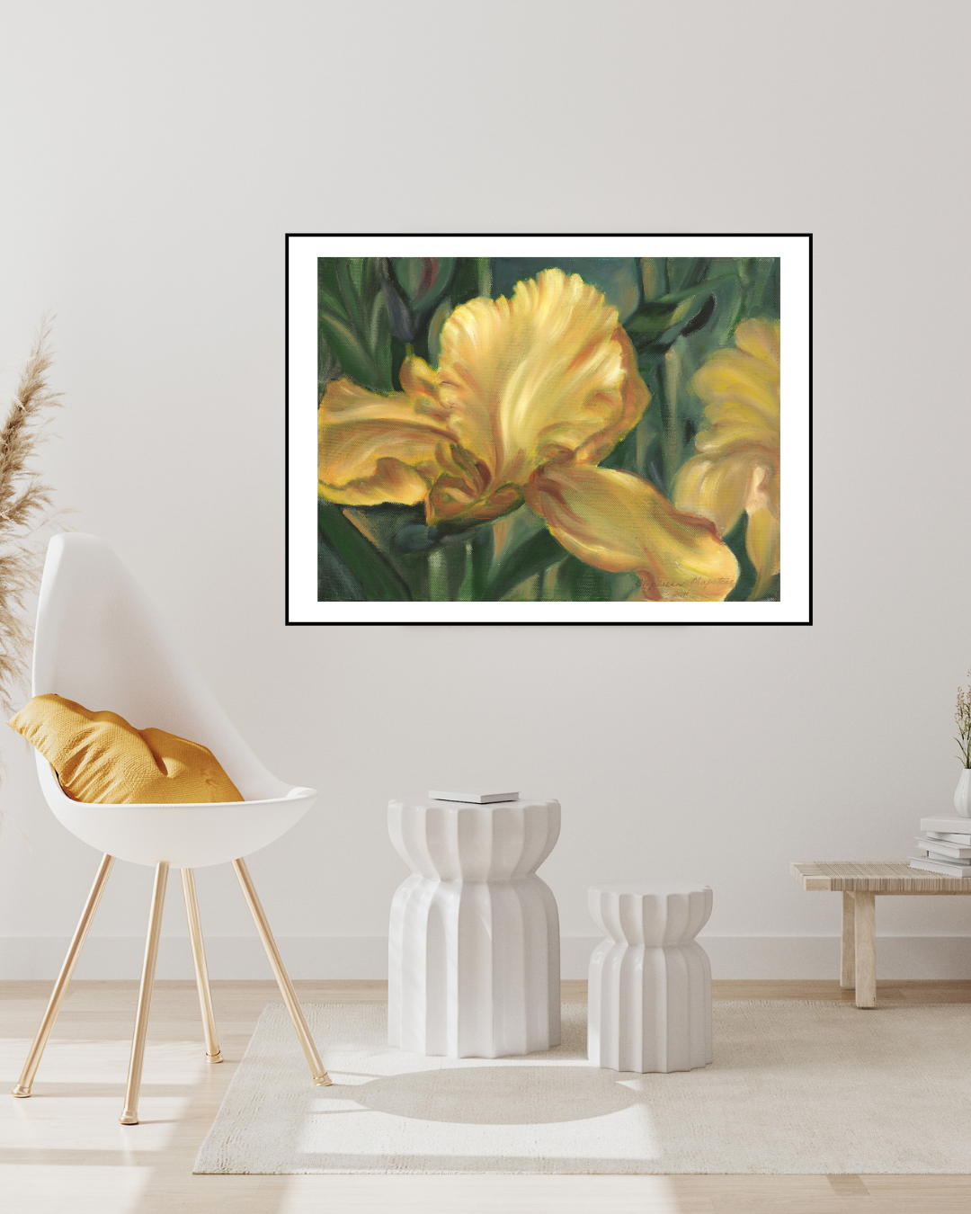 Limited edition print of 'Yellow Iris' framed in white, displayed in a softly lit room with white furniture and floor. The bold yellow artwork enhances the ambiance, adding a strong accent to the space.