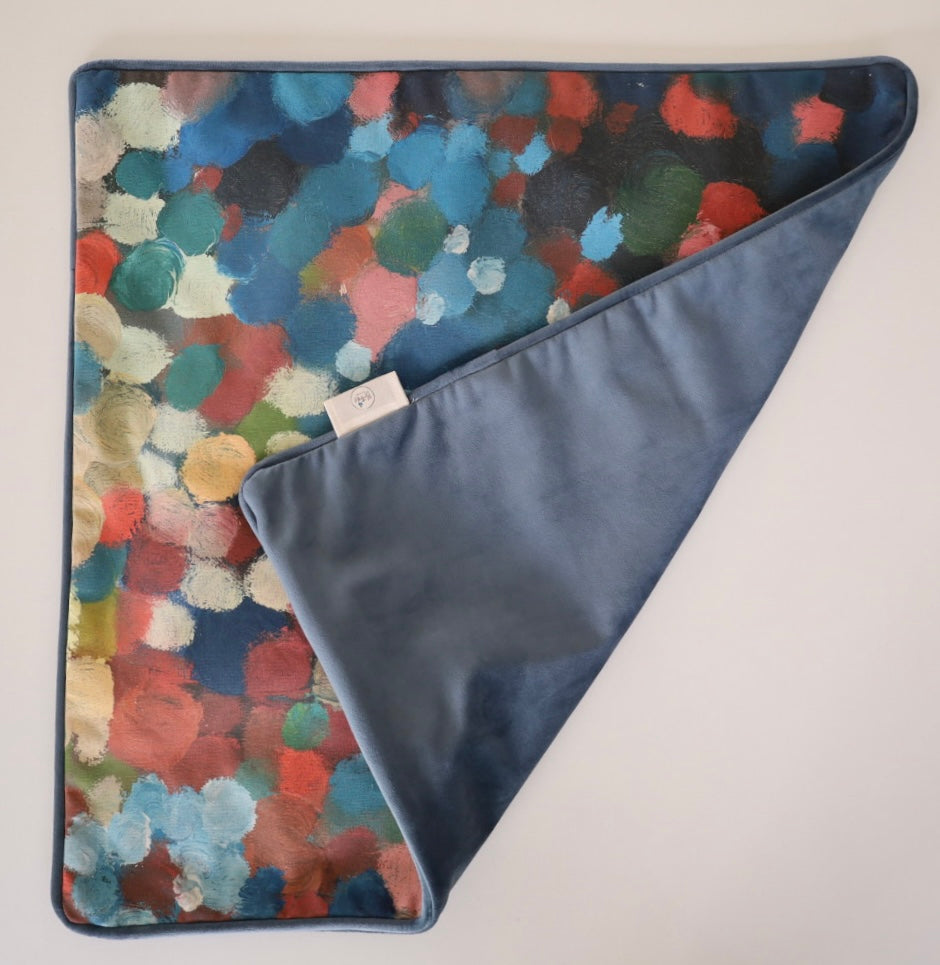Image shows folded back and front of square 60×60 cm cushion cover with abstract salmon, pink and blue oil painting print, velvet piping, velvet back, and concealed zip closure.