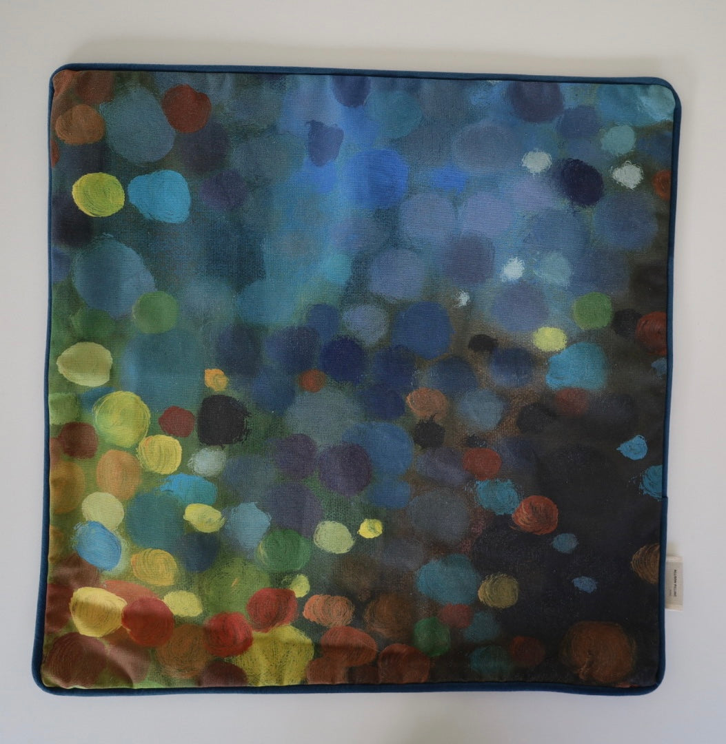 Image shows front of square 60×60 cm cushion cover with abstract green, yellow, rust and blue oil painting print, velvet piping, velvet back, and concealed zip closure.