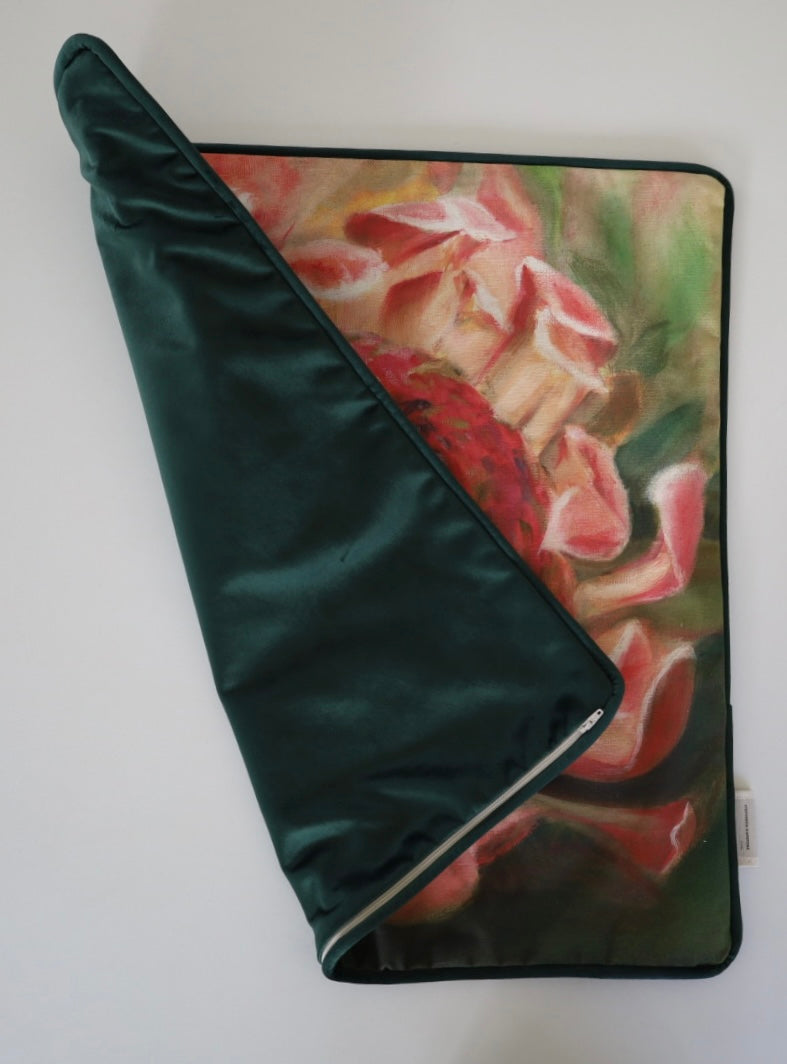 Image shows  folded front and back of square 60×60 cm cushion cover with pale delicate pink  protea with green leaves from oil painting print, velvet piping, velvet back, and concealed zip closure.